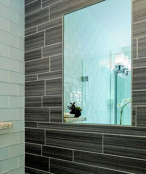 Flush-mount, fog-free shower mirror.