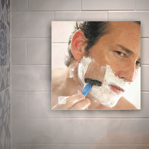 Man shaves in the shower with Clarity fog-free mirror from ClearMirror